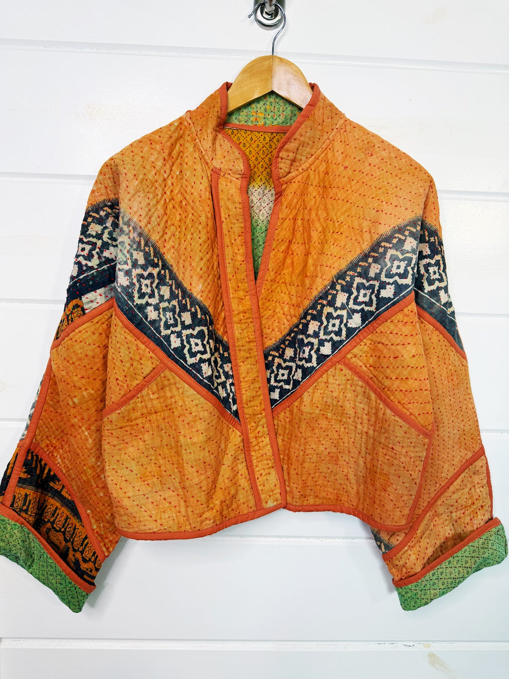 Stevie style revival kantha jacket #2311, on a hanger, front view with sleeves out