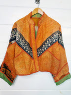Stevie style revival kantha jacket #2311, on a hanger, front view with sleeves out