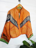 Stevie style revival kantha jacket #2311, patchwork kantha on a hanger, front view