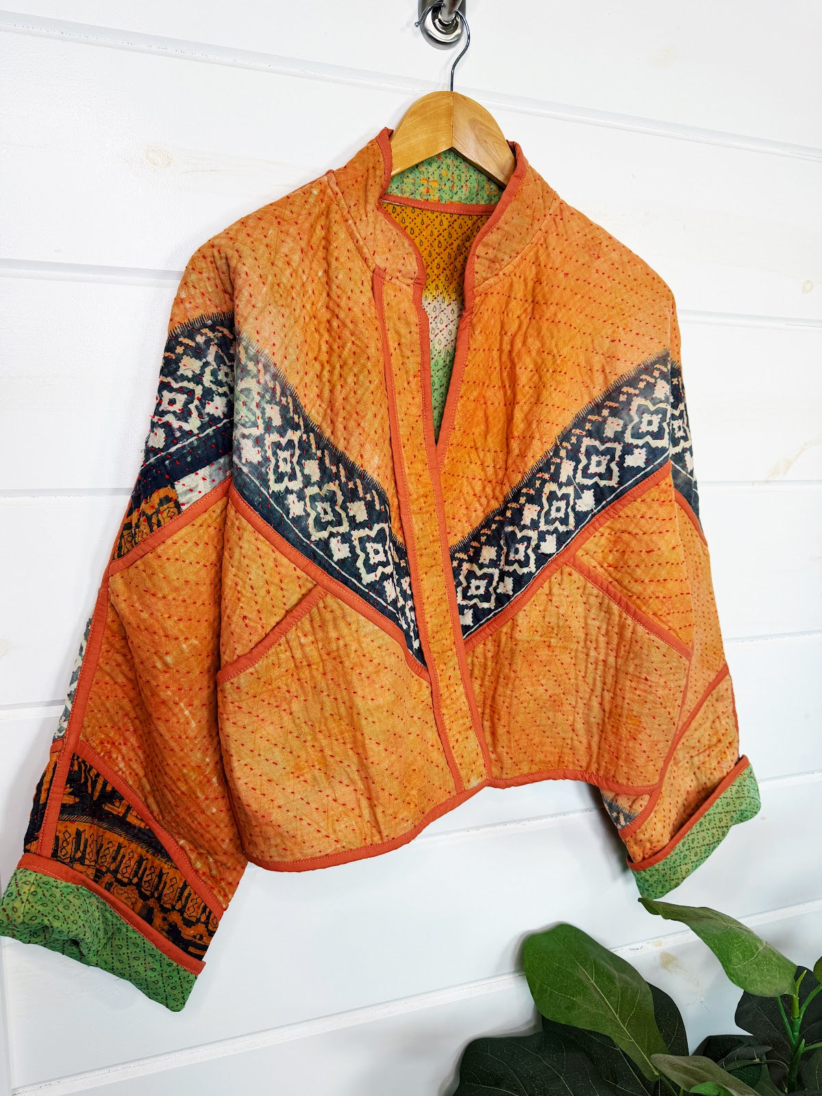 Stevie style revival kantha jacket #2311, patchwork kantha on a hanger, front view