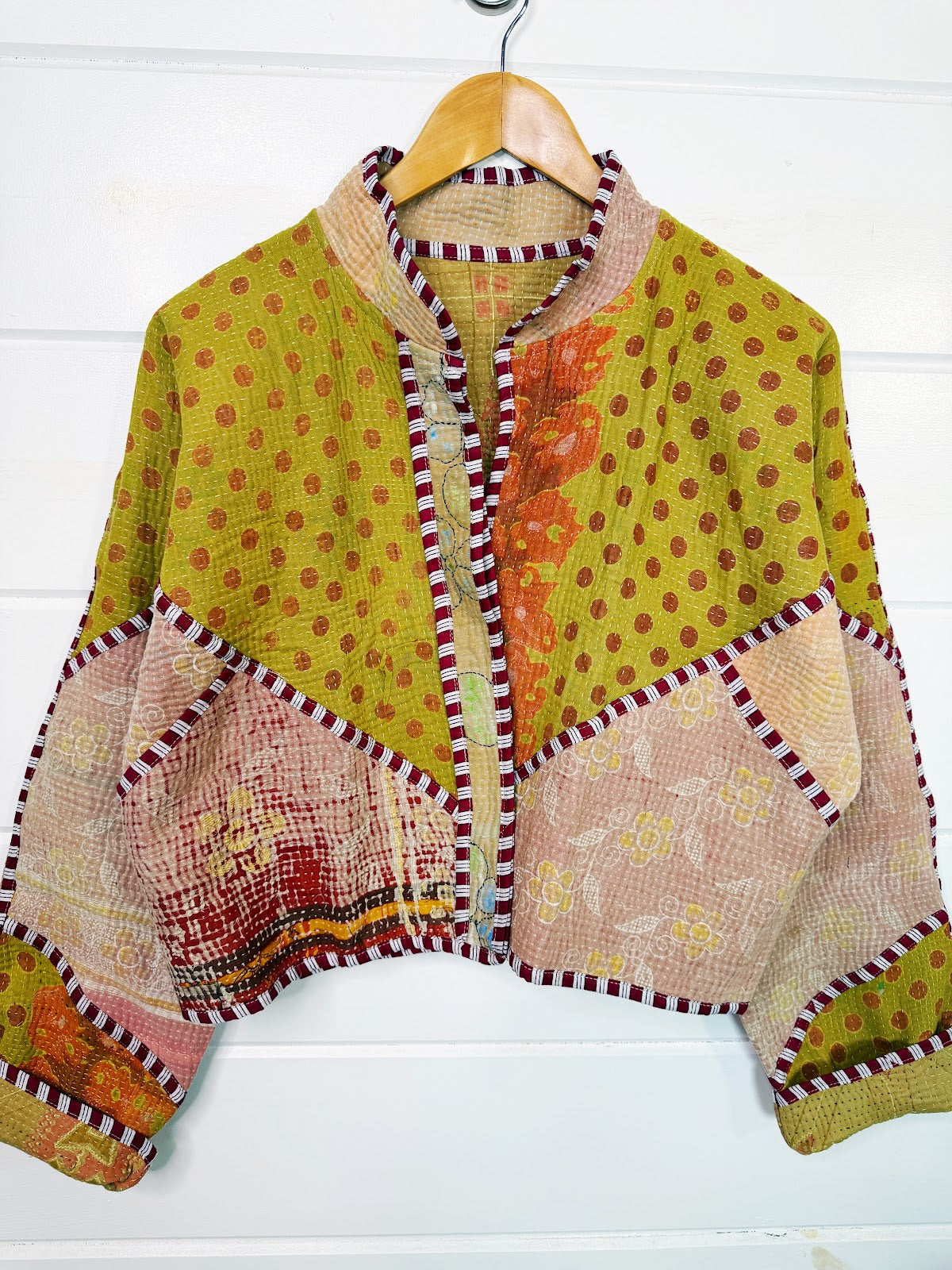 Stevie style revival kantha jacket #2309, on a hanger, front view with sleeves out