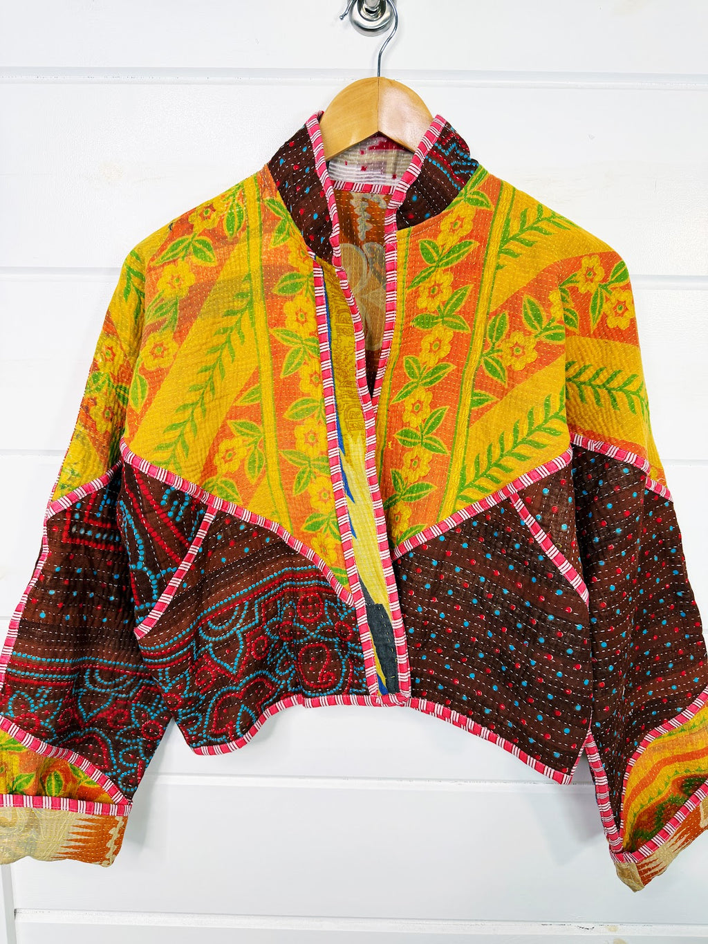 Stevie style revival kantha jacket #2315, on a hanger, front view with sleeves out