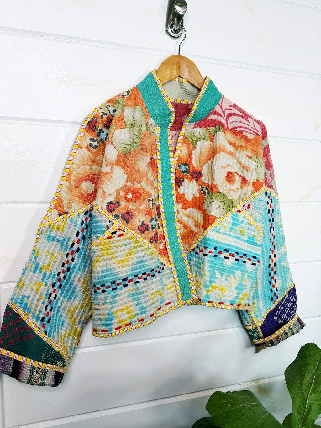 Stevie style revival kantha jacket #2313, patchwork kantha on a hanger, front view