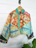 Stevie style revival kantha jacket #2313, patchwork kantha on a hanger, front view