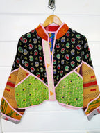 Stevie style revival kantha jacket #2310, on a hanger, front view with sleeves out