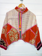 Stevie style revival kantha jacket #2308, on a hanger, front view with sleeves out