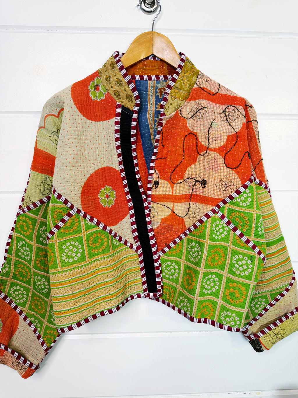 Stevie style revival kantha jacket #2302, on a hanger, front view with sleeves out