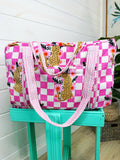 Pink Checkered Jaguar print quilted weekender bag, on a stand, front view