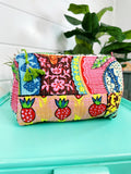 Festival print quilted cosmetic bag, front view, print placement varies